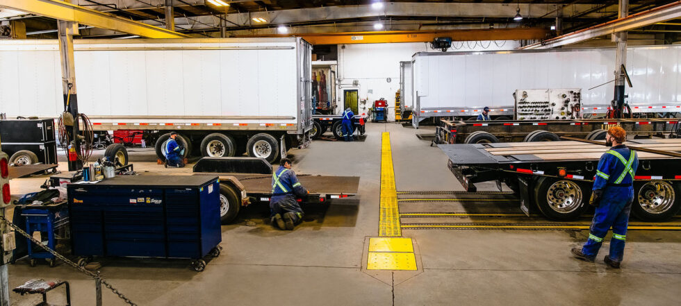 Truck on open road at sunset